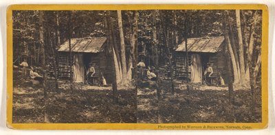 [La familia posa delante de su cabaña de madera en el bosque] de Whitney and Beckwith