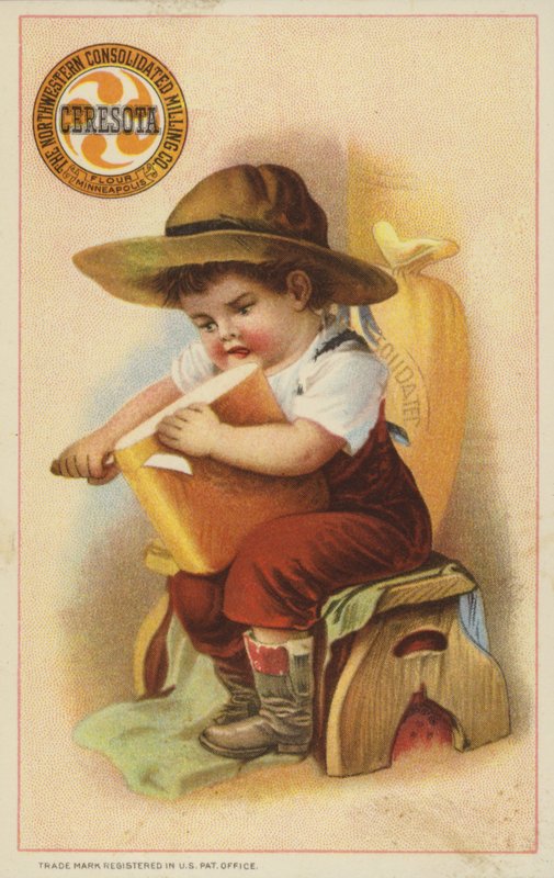 Niño cortando una barra de pan de American School