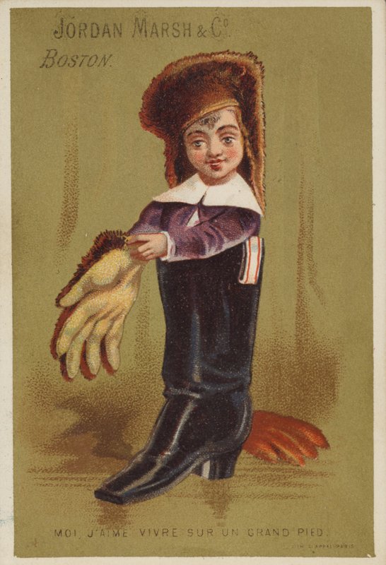 Niño de pie en bota de adulto de American School