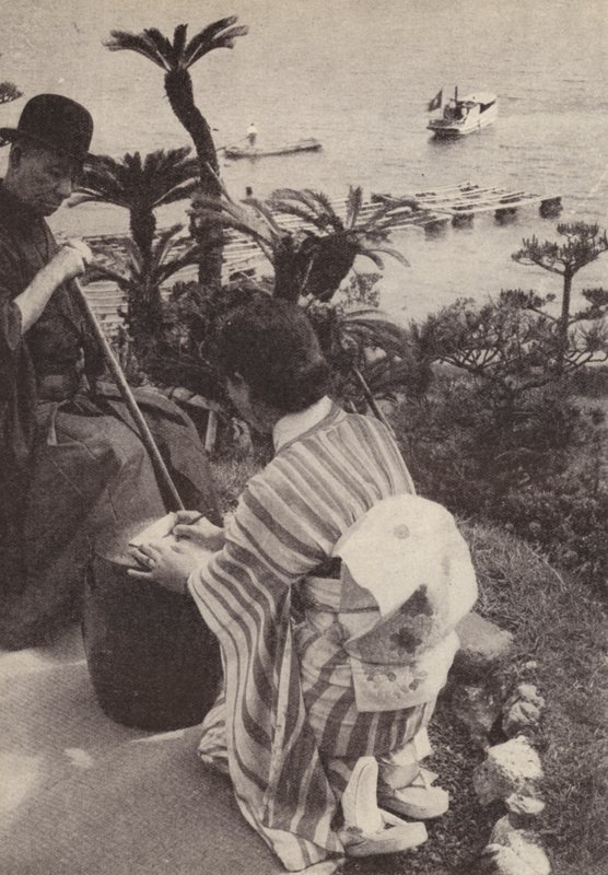 Empresario japonés y su secretaria tomando notas taquigráficas de Photographer Japanese