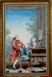 Wolfgang Amadeus Mozart (1756-1791) de niño tocando el piano con su padre y hermana