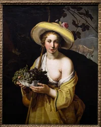 Bergere con un plato de uvas