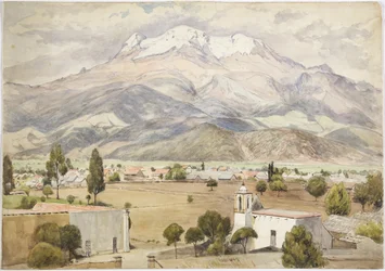 Pueblo en primer plano y montañas detrás