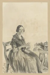 Pauline Martini, de soltera Dambke, sentada a la mesa, con la mirada dirigida hacia el espectador