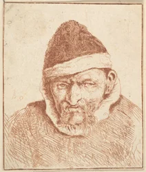 Anciano con cuello blanco y sombrero puntiagudo