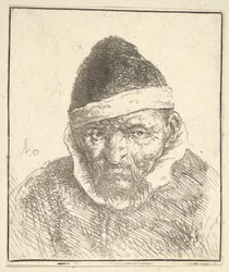 Anciano con cuello blanco y sombrero puntiagudo