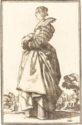 Noble mujer de perfil con las manos en un manguito