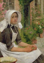 Niña desgranando guisantes