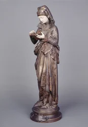 El lector (escultura de marfil y bronce)