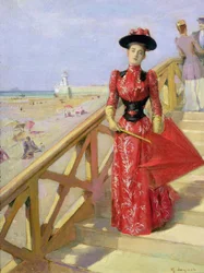 Mujer bajando escaleras hacia una playa
