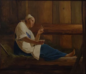 Niña en un colchón de heno