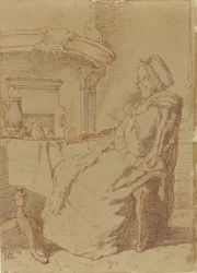 Anciana sentada, tejiendo en una mesa