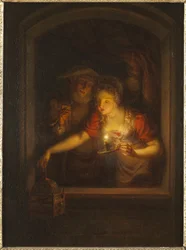 Una mujer con una vela encendida