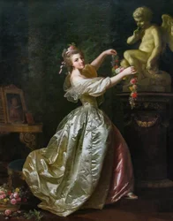 Mujer joven decorando la estatua del amor