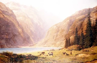 Un paisaje lacustre montañoso con ganado