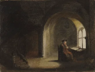 Hombre sentado junto a una ventana
