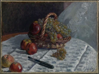 Manzanas y uvas en una cesta