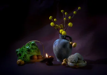Bodegón de cosecha a la luz de las velas