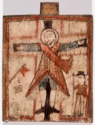 Figura uniformada en la cruz