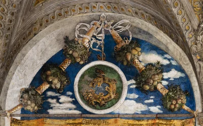 Palacio Ducal: pared noroeste de la Cámara Nupcial o Camera Picta, que es una sala situada en la torre noreste del Castillo de San Giorgio de Mantua. Es famosa por el ciclo de frescos que cubre sus paredes, obra maestra de Andrea Mantegna, cre