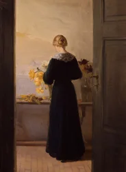 Chica arreglando flores
