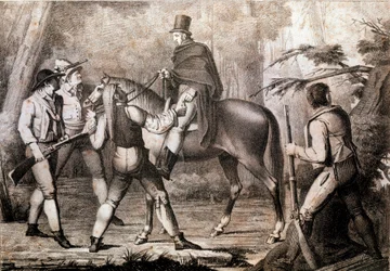 Bandidos atacando a un viajero a caballo