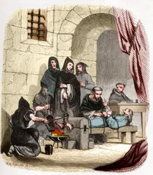 Inquisición en España en el siglo XV: María de Borgoña (1457-1482), acusada de ser judía, es torturada por san Pedro de Arbues (1441/1442-1485), inquisidor español: le quema los pies. Ilustración en «Misterios de la Inquisición» y