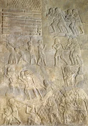 Relieve que representa porteadores llevando madera a la costa para su transporte por mar, del Palacio de Sargón II, Khorsabad, Irak
