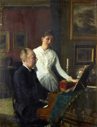 El actor Peter Jerndorff y su esposa Amalie al piano