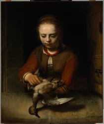 Niña desplumando un pato