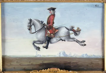 No. 51 Un caballo gris moteado de la Escuela Española de Equitación realizando un movimiento de doma llamado Capriole