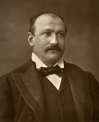 Actor británico Augustus Harris en Human Nature, 1886