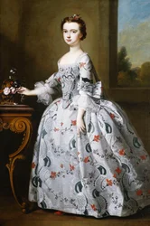 Retrato de una Chica, de Cuerpo Entero, en un Vestido de Satén Gris con Elaborado Bordado Floral, Junto a una Cesta de Flores sobre una Mesa, un Paisaje Boscoso al Fondo