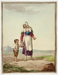 Mujer vestida de india con niño en la carretera