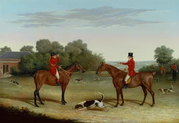 El maestro con perros de caza fuera de las perreras