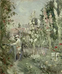 Niño joven en los malvarrosas