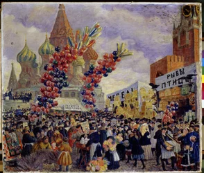 Una feria en la plaza roja del Kremlin en Moscú (Cabinas de exhibición). La multitud se abre paso entre las distintas plataformas comerciales del mercado decoradas con gigantescos racimos de globos. Podemos ver la Catedral de San Basilio en Moscú (San Basi