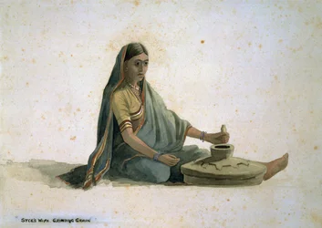 La esposa de Syce, moliendo grano, India