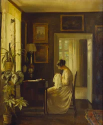 Un interior con una mujer cosiendo