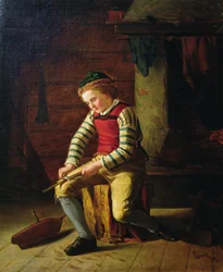 Niño haciendo un bote de madera