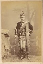 Retrato de un hombre con traje escocés
