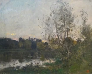 Un lago en el bosque al atardecer