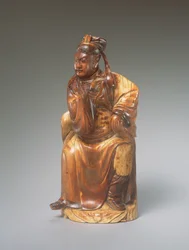 Figura de Guandi sentado, siglo XIV-XV (marfil tallado)