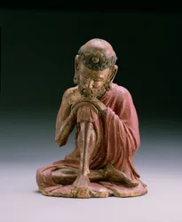 Figura de laca roja de Sakyamuni, el fundador de la fe budista, emergiendo de las montañas, Dinastía Yan, 1280-1368 (madera y dorado)