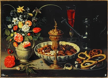 Mesa con jarra, flores, frutos secos ...