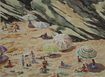 Playa, rocas y sombrillas