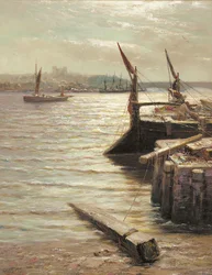 Barcazas amarradas junto a la orilla del río