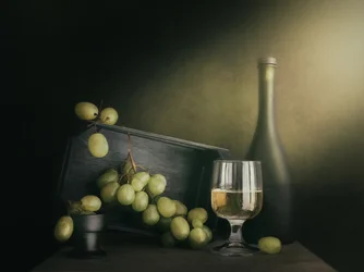Vino blanco y uvas