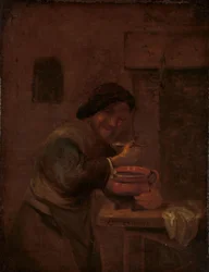 Hombre comiendo de una olla de barro