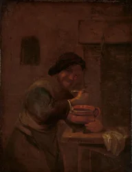 Hombre comiendo de una olla de barro